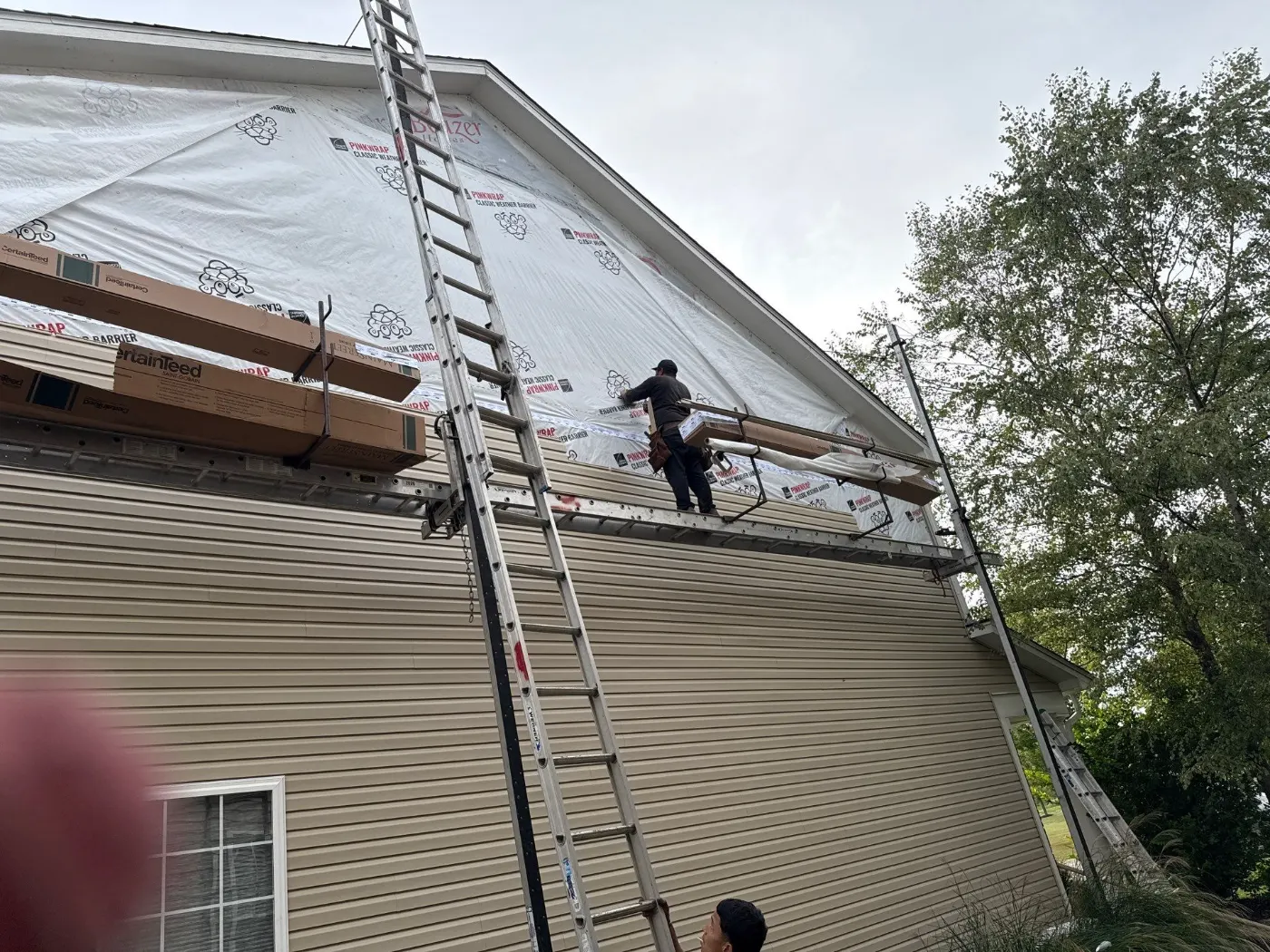 Siding installation documented in Rocky Ripple